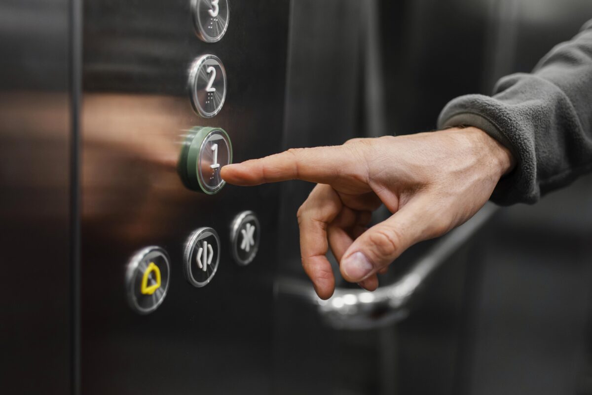 delivery-man-with-package-at-elevator-close-up