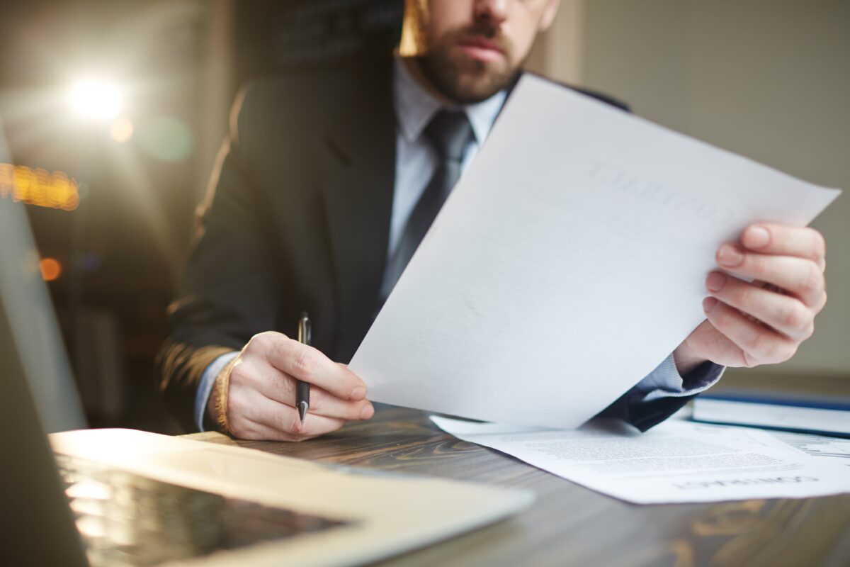 businessman-working-with-documentation-desk-min